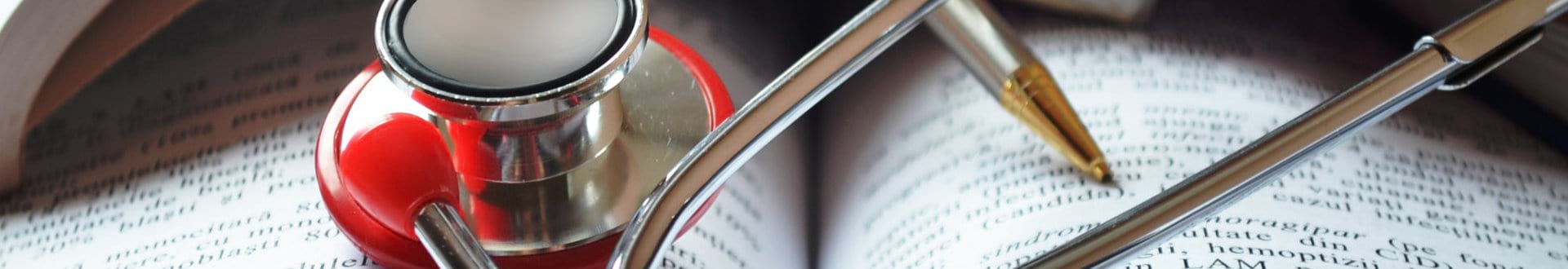 stethoscope on top of a book