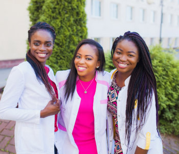three nurses smiling